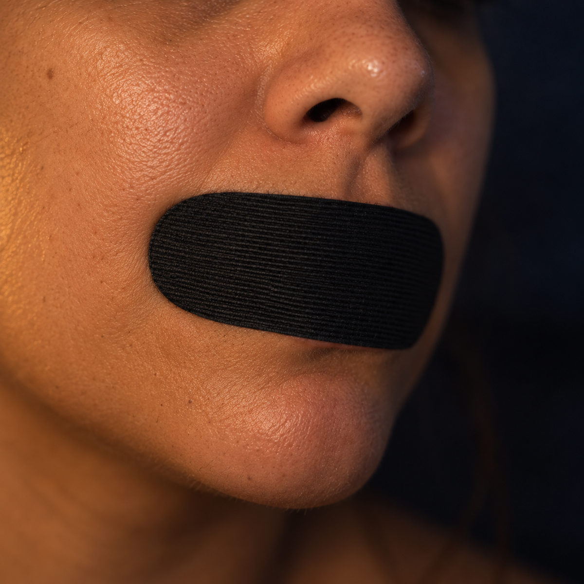 Close-up of Soneca mouth tape on the lips showing the fabric texture